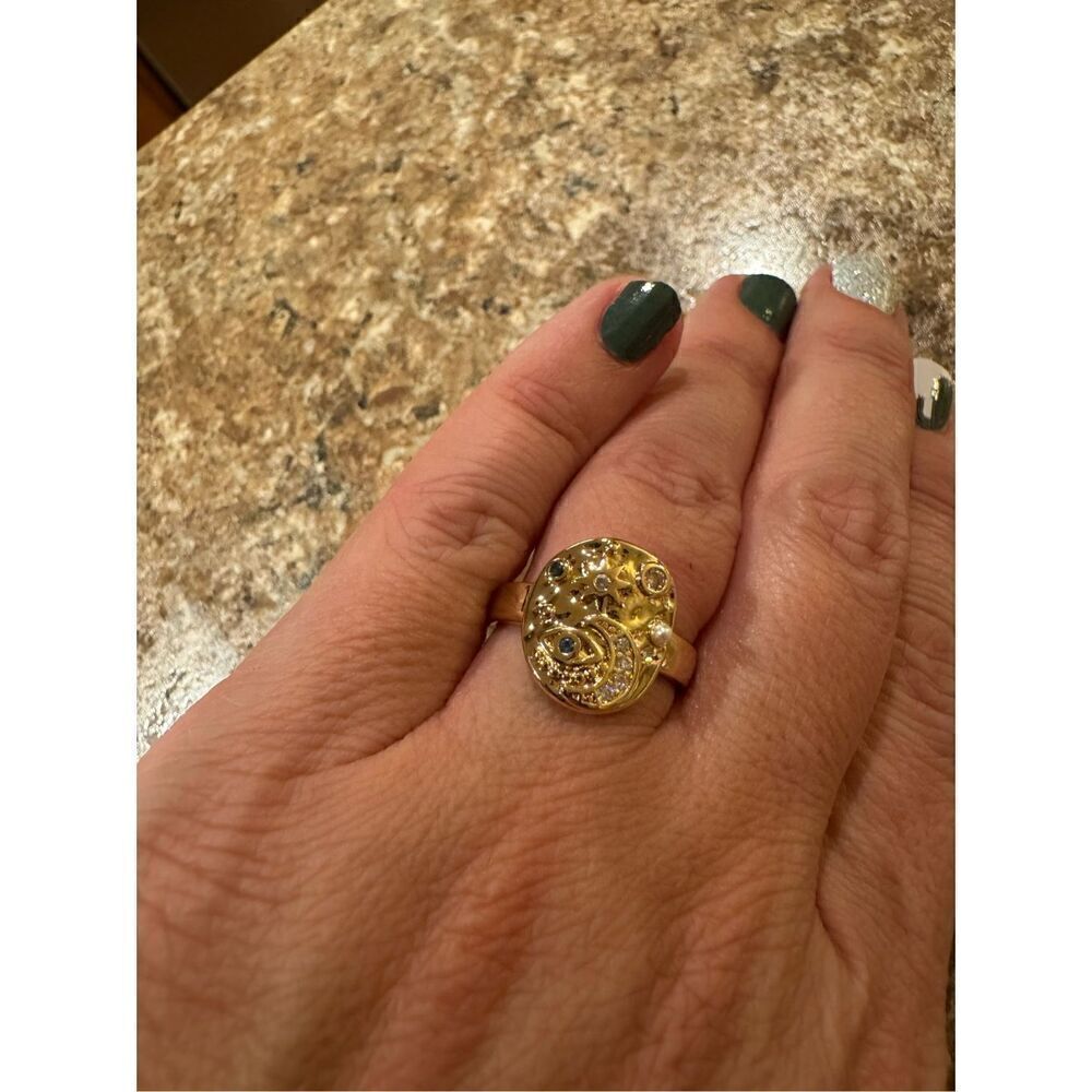Woman’s gold plated galaxy/universe ring